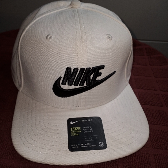 White and blue Nike unisex ADULT hat.